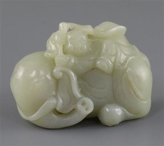 A Chinese pale celadon jade group of a boy on a recumbent elephant, 19th century, L.6.5cm